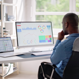 Black man reviewing DEI analytics on computer screen